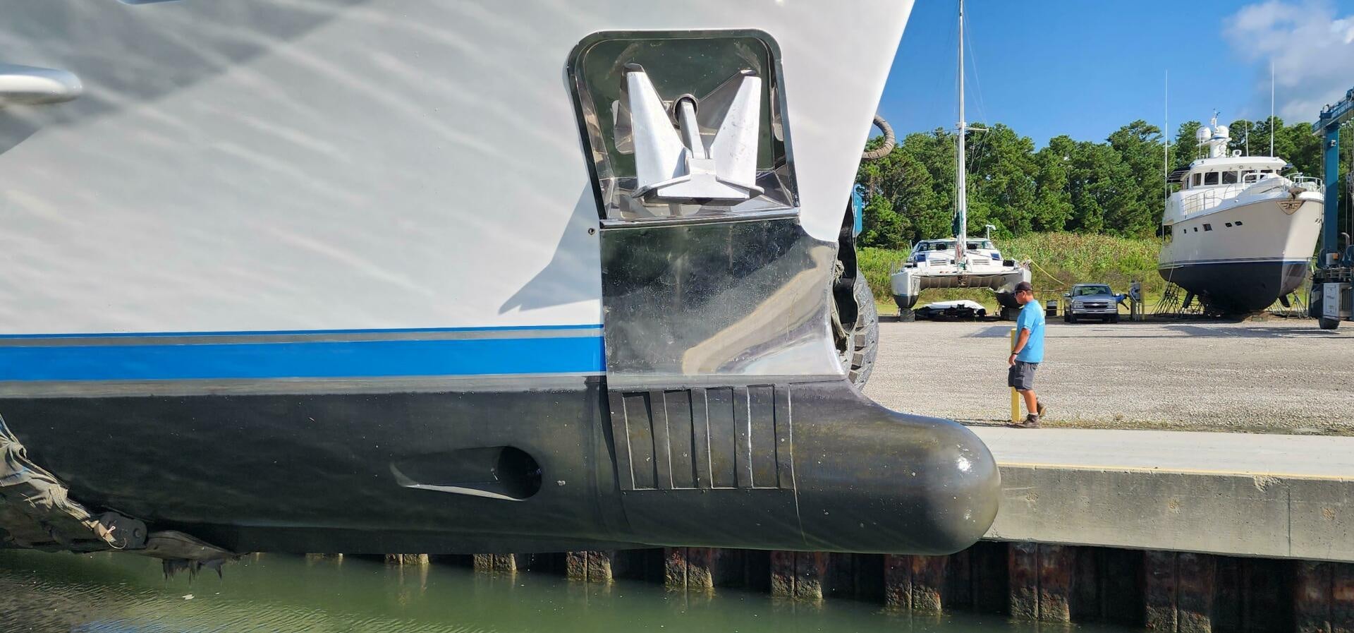 a person standing next to a submarine aboard BLUE SEAS Yacht for Sale