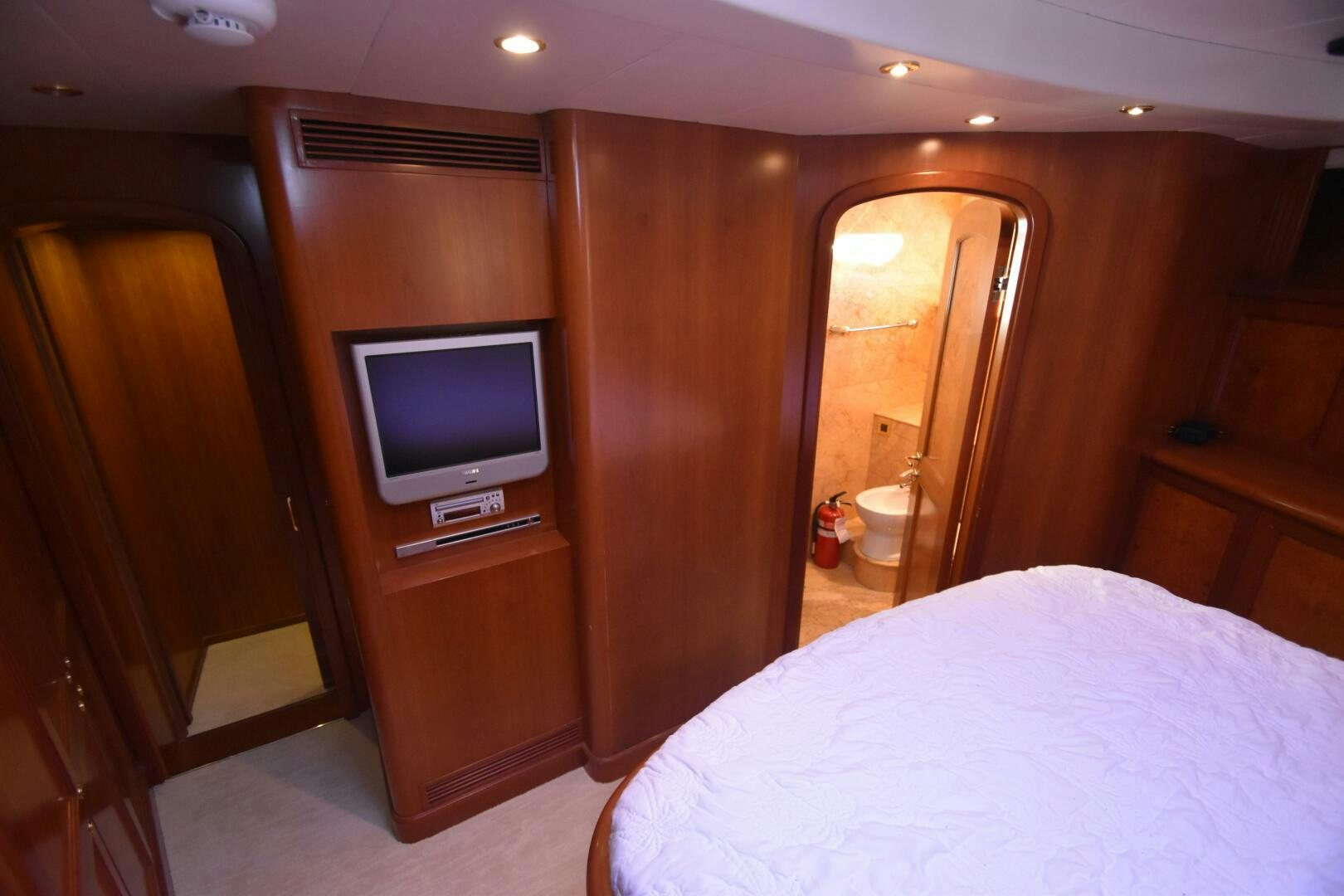 a bedroom with a tv and a bed aboard BLUE SEAS Yacht for Sale