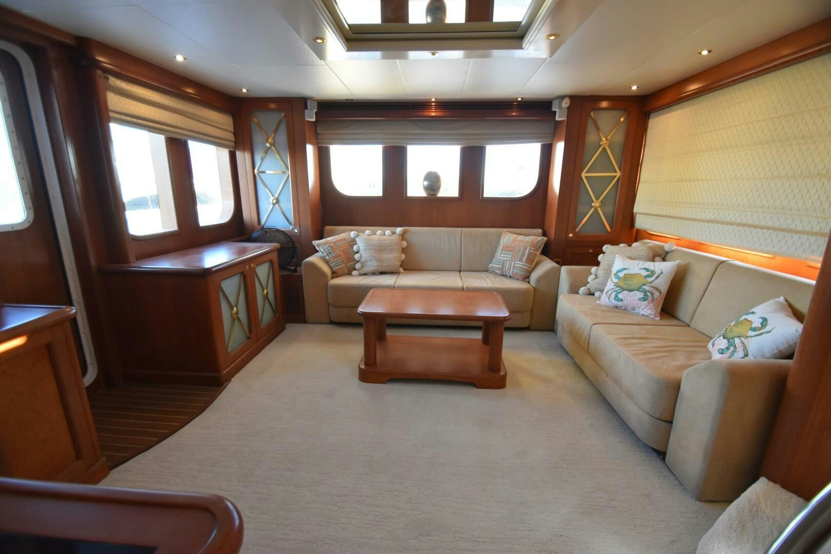a living room with a couch and a table aboard BLUE SEAS Yacht for Sale