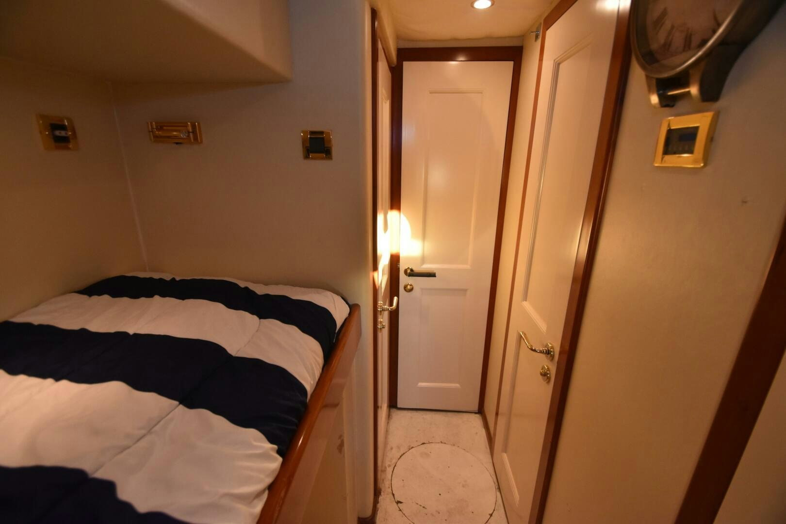 a bedroom with a bed and a door aboard BLUE SEAS Yacht for Sale
