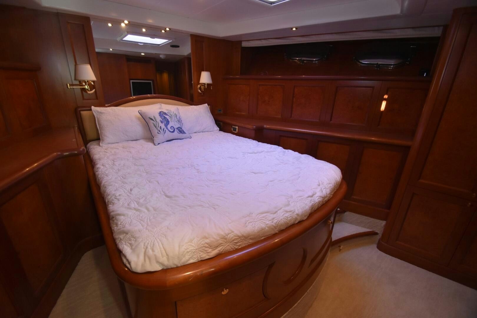 a bed with a white comforter aboard BLUE SEAS Yacht for Sale