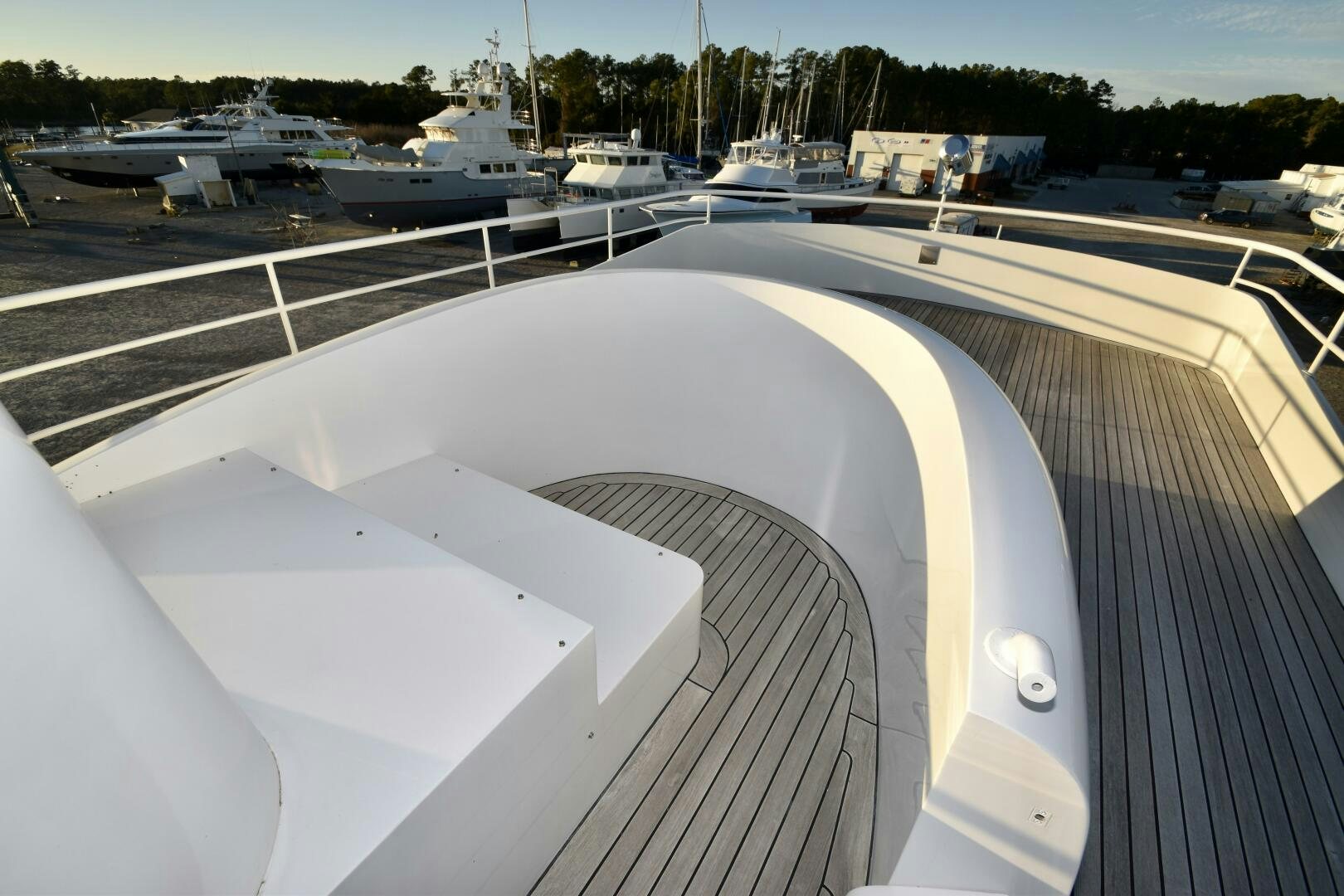 a deck with a deck and a view of a ship and other boats aboard BLUE SEAS Yacht for Sale