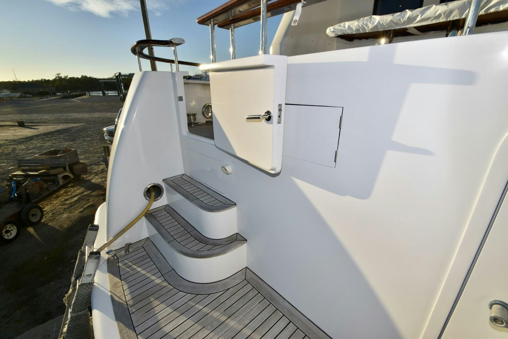a white boat on a deck aboard BLUE SEAS Yacht for Sale