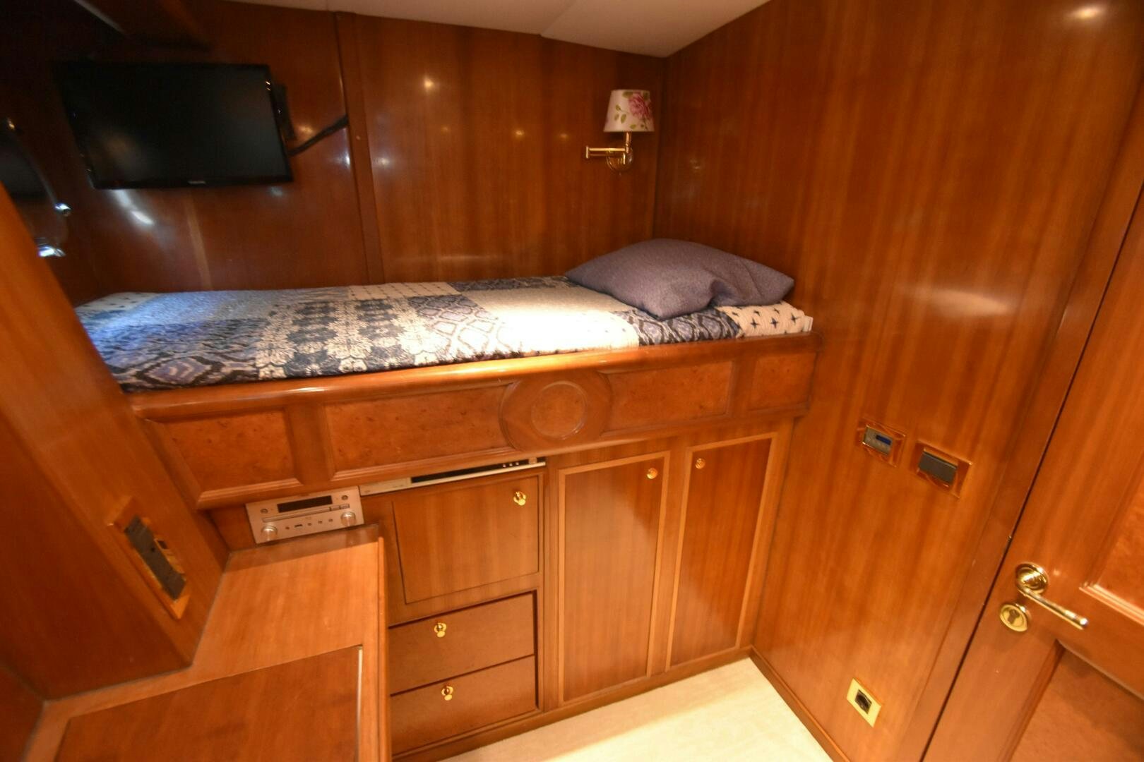 a room with a bed and a television aboard BLUE SEAS Yacht for Sale