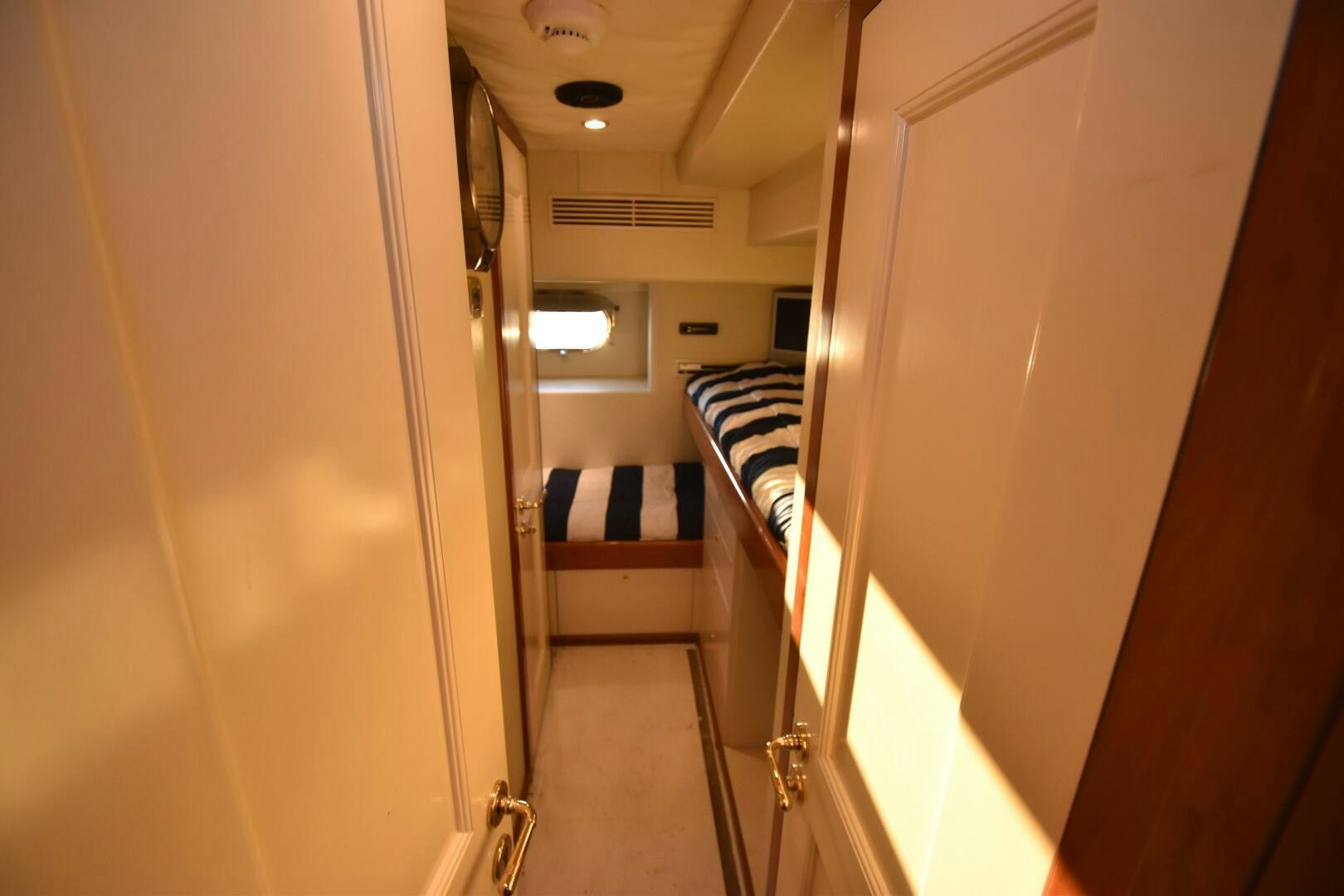 a hallway with a striped rug aboard BLUE SEAS Yacht for Sale