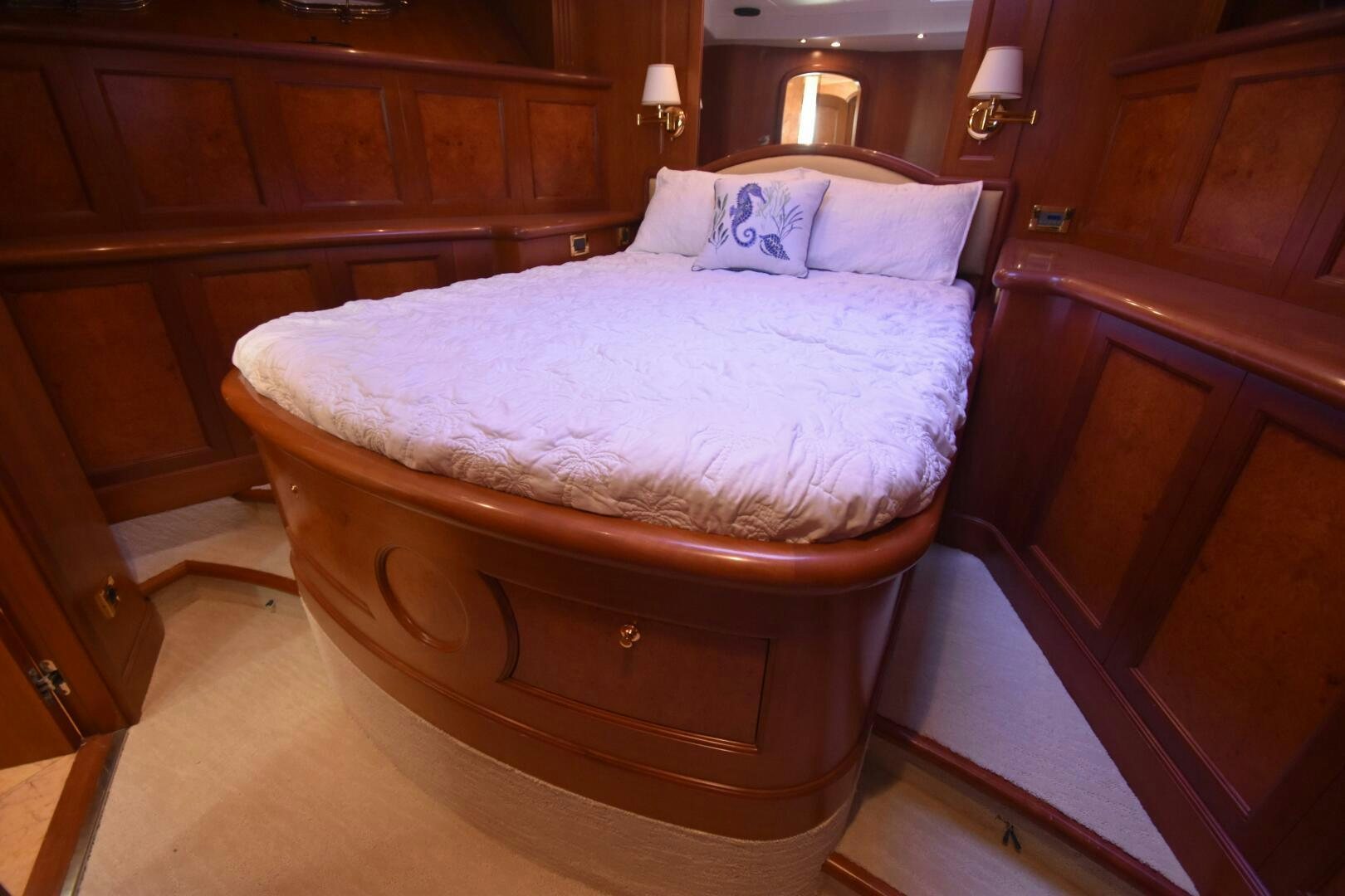 a bed with a white comforter aboard BLUE SEAS Yacht for Sale