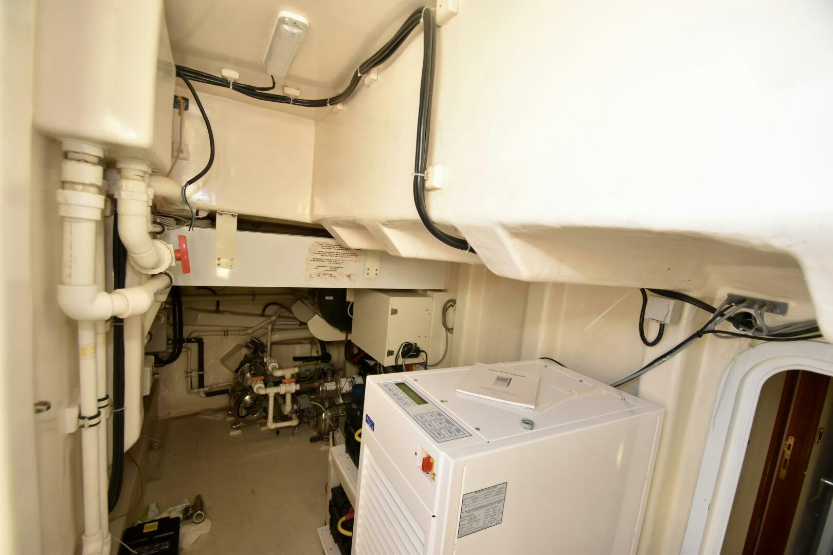 a white machine in a room aboard BLUE SEAS Yacht for Sale
