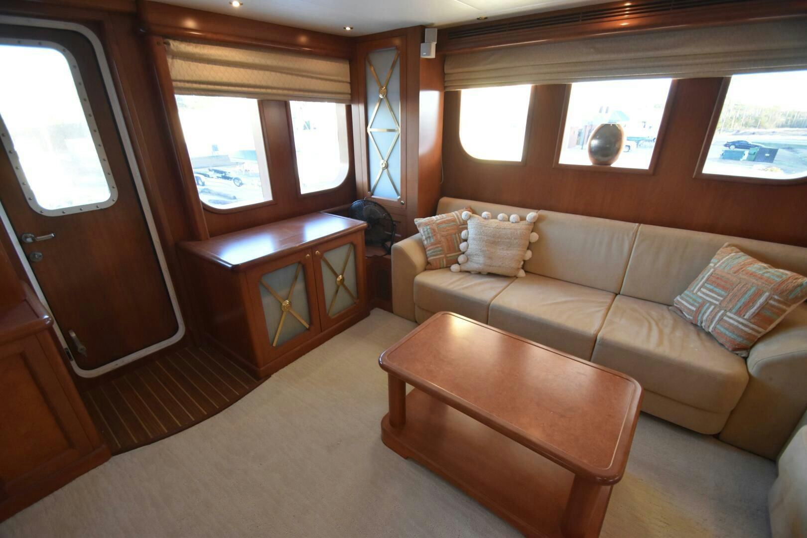a living room with a couch and a coffee table aboard BLUE SEAS Yacht for Sale