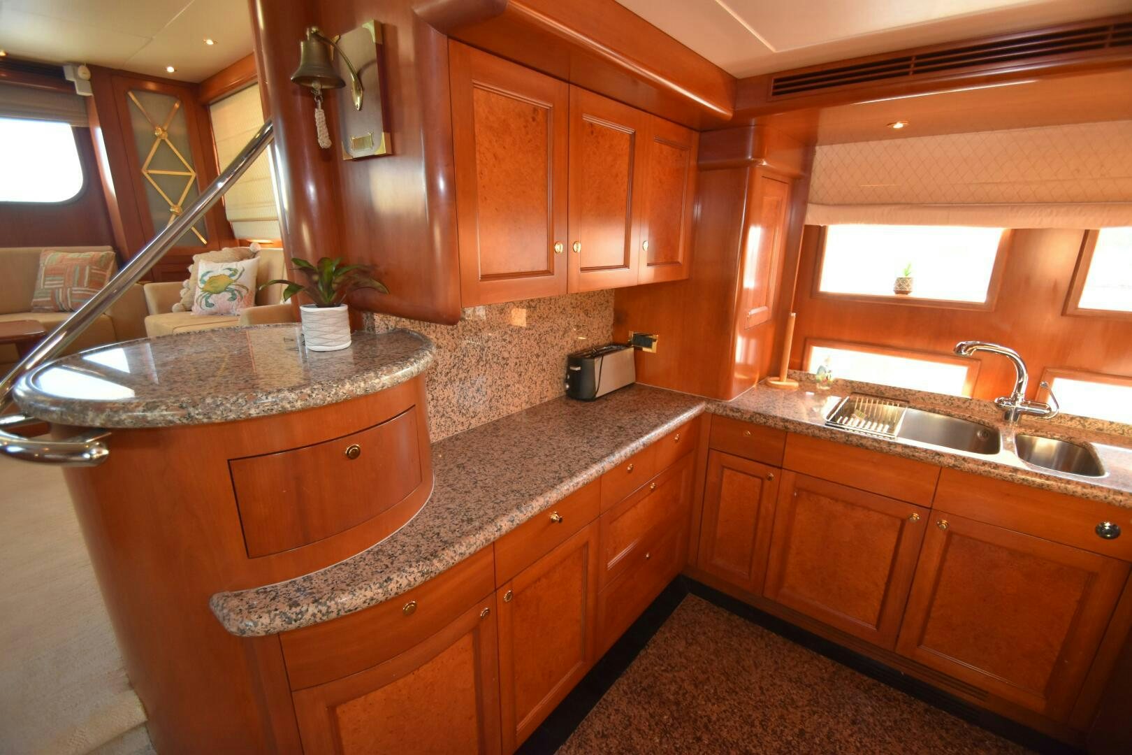 a kitchen with wooden cabinets aboard BLUE SEAS Yacht for Sale
