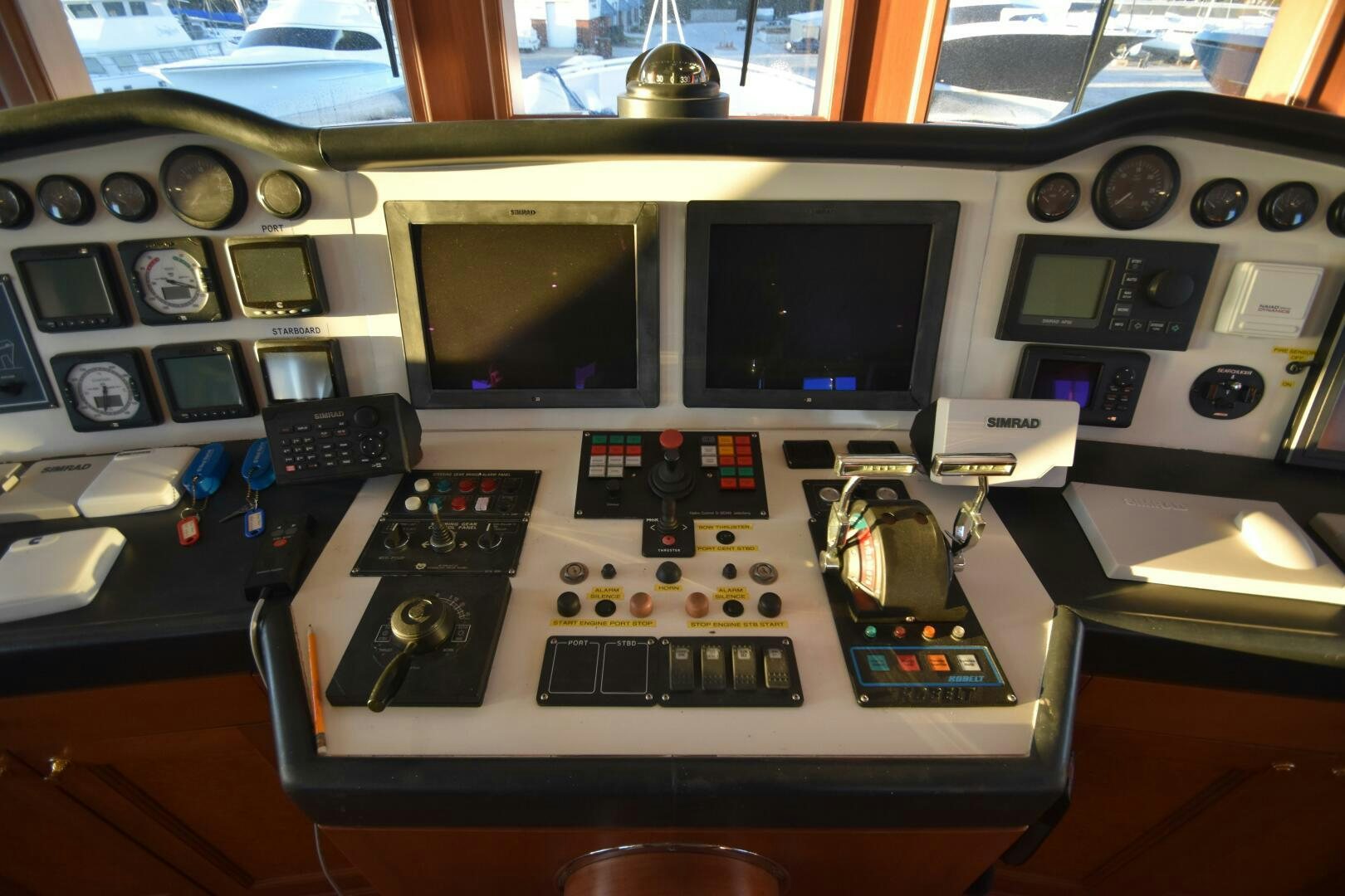 a control panel with a monitor and other electronic devices aboard BLUE SEAS Yacht for Sale