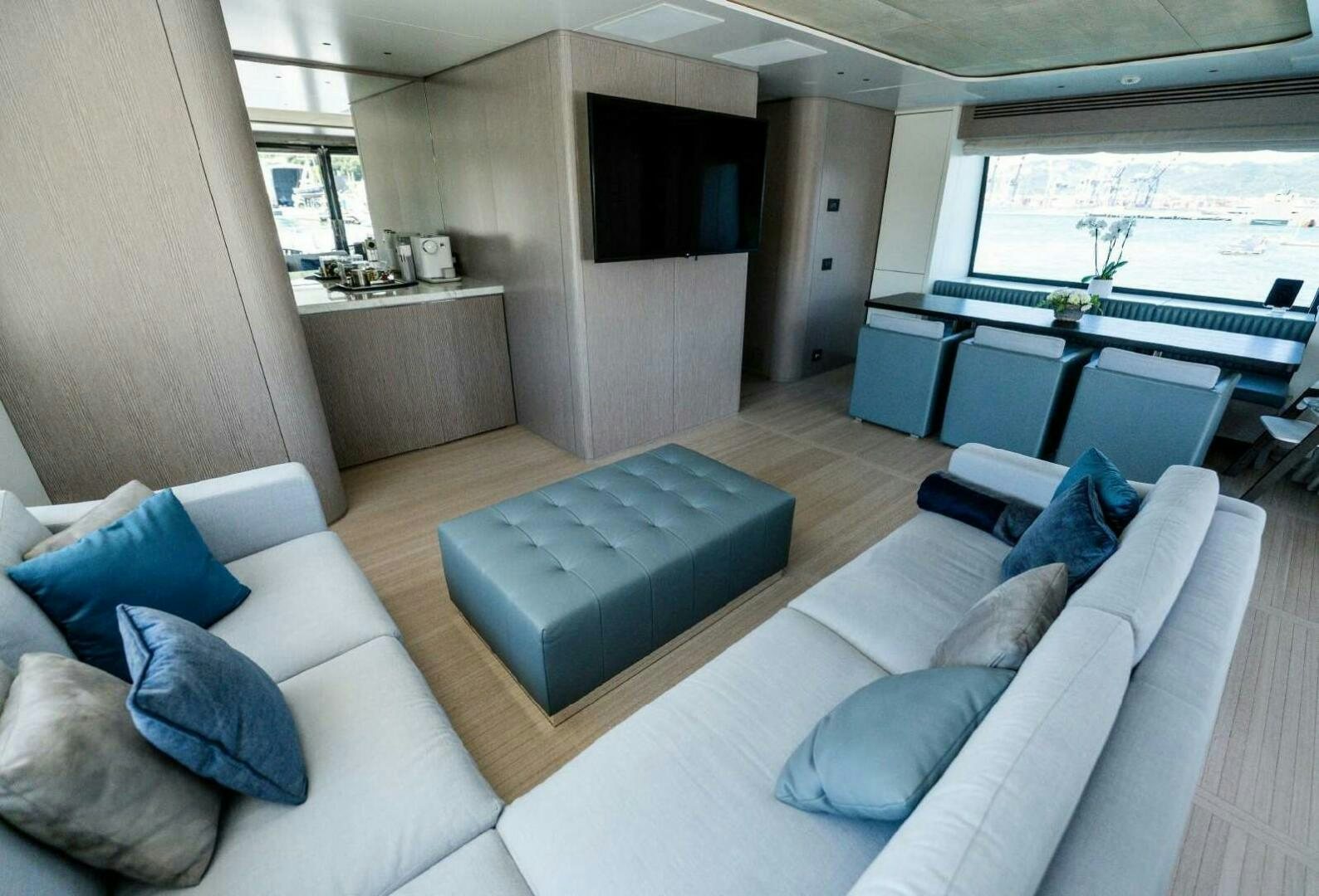 a living room with a couch and a table aboard SEAESTA Yacht for Sale
