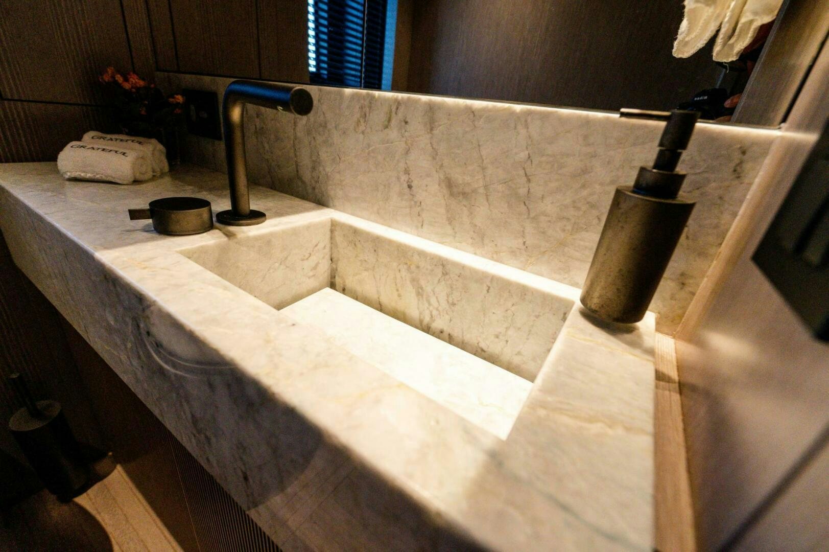 a large bathroom with a large tub aboard SEAESTA Yacht for Sale