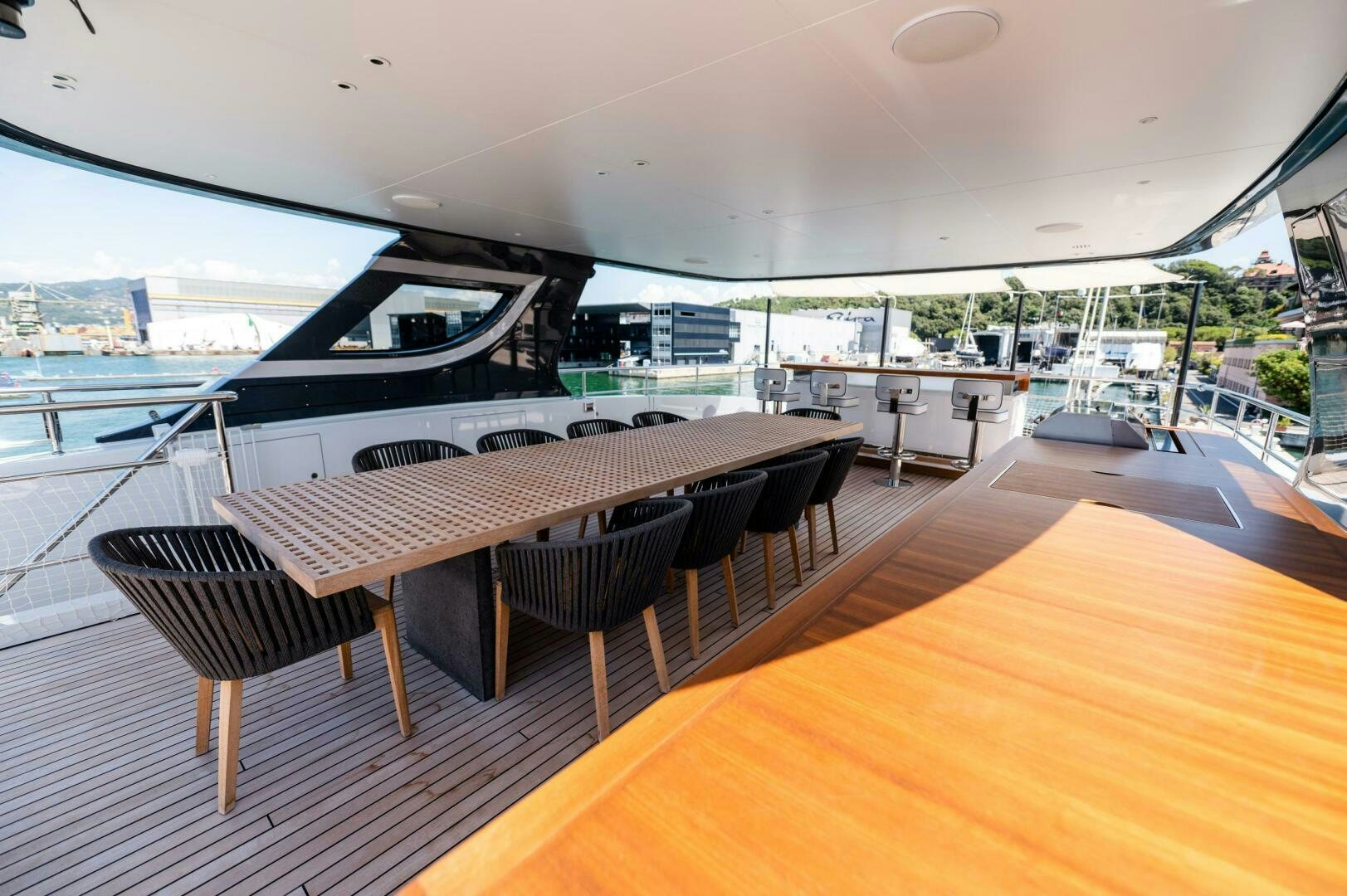 a table and chairs on a deck aboard SEAESTA Yacht for Sale