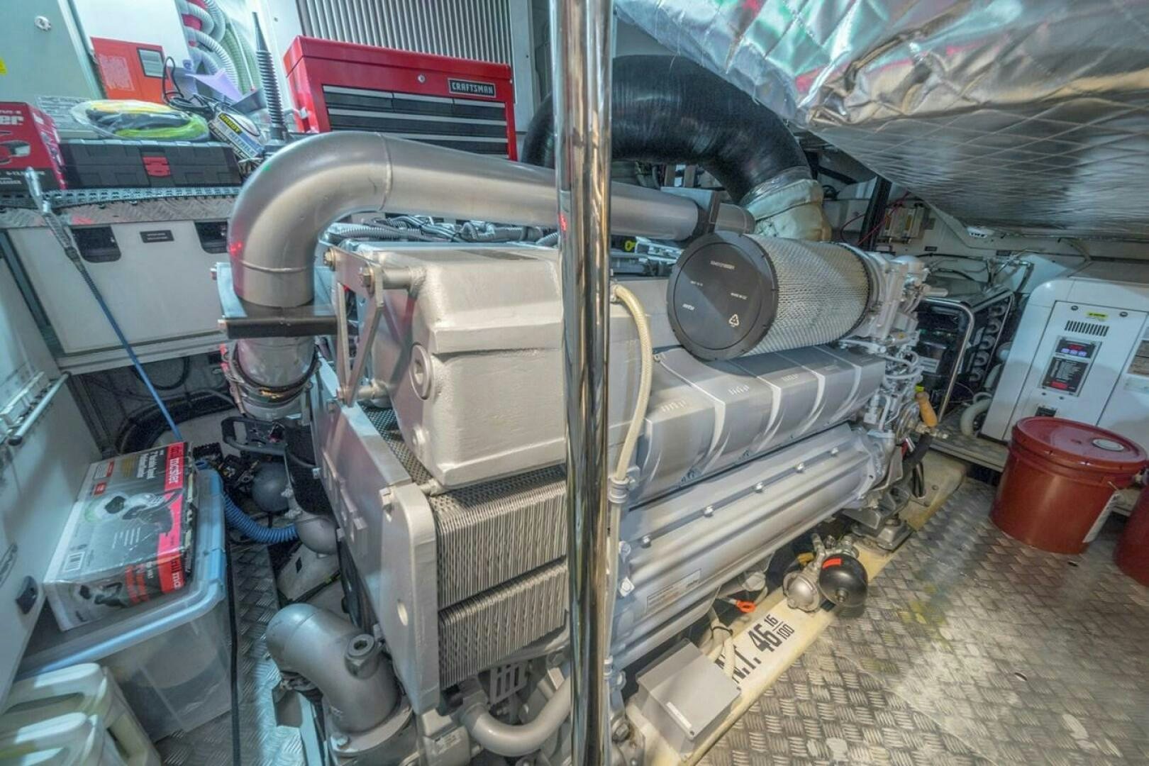 a car with a large engine aboard STAR Yacht for Sale