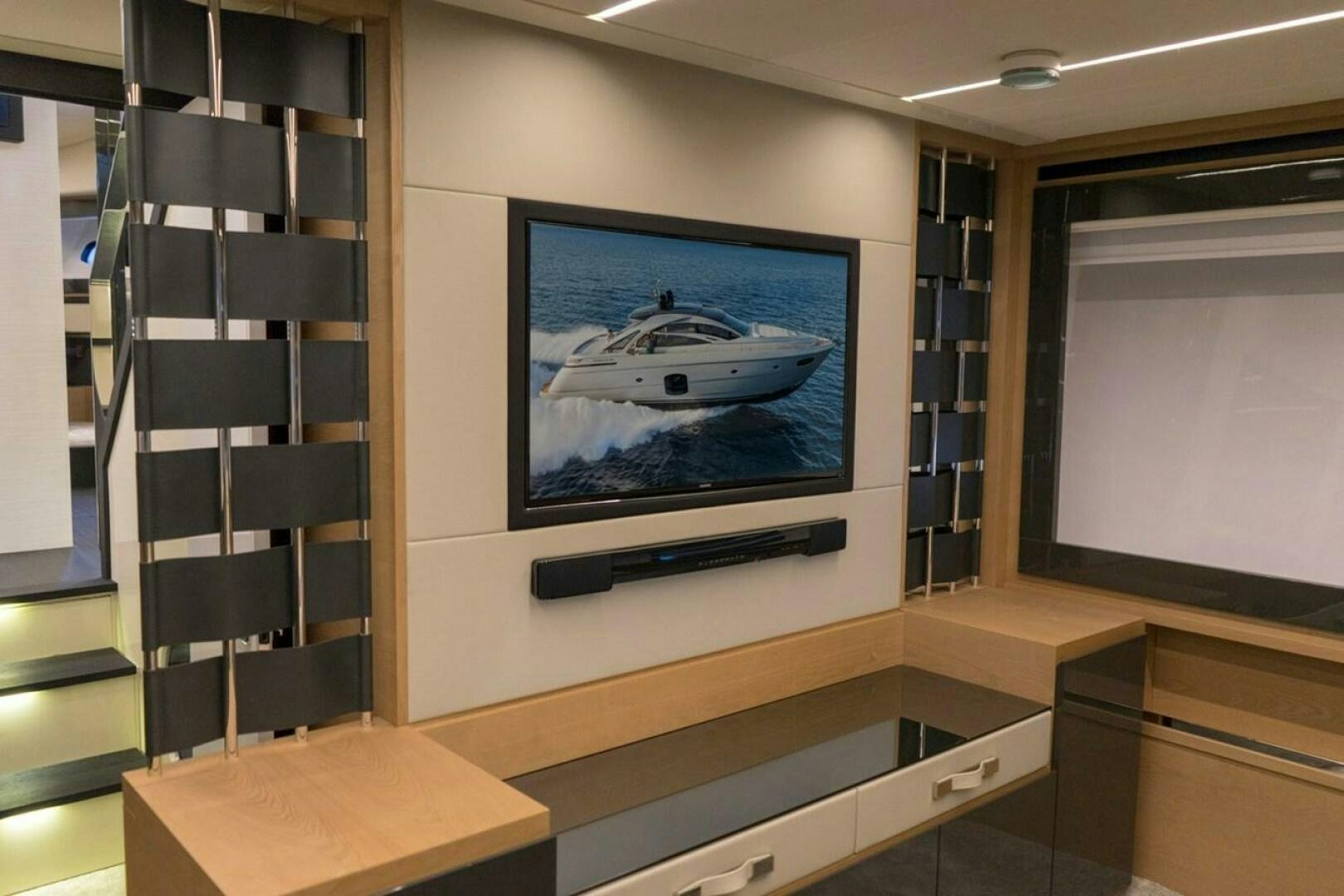 a tv on a wall aboard STAR Yacht for Sale