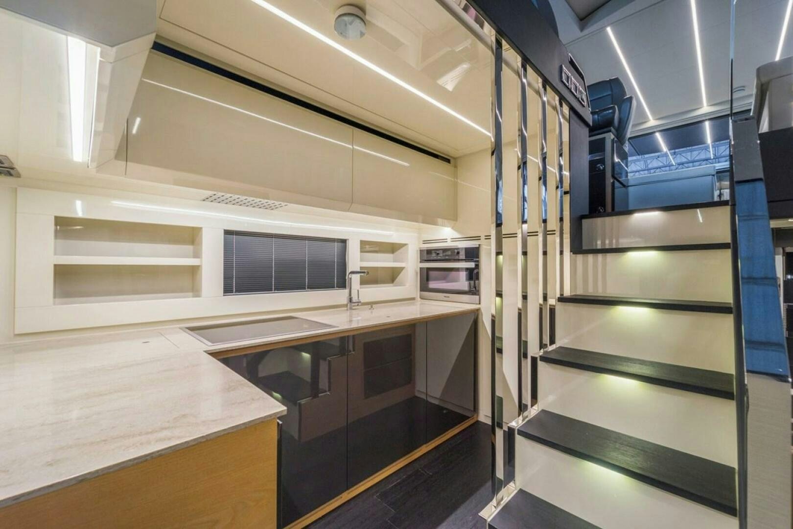 a room with a large shelf and a tv aboard STAR Yacht for Sale