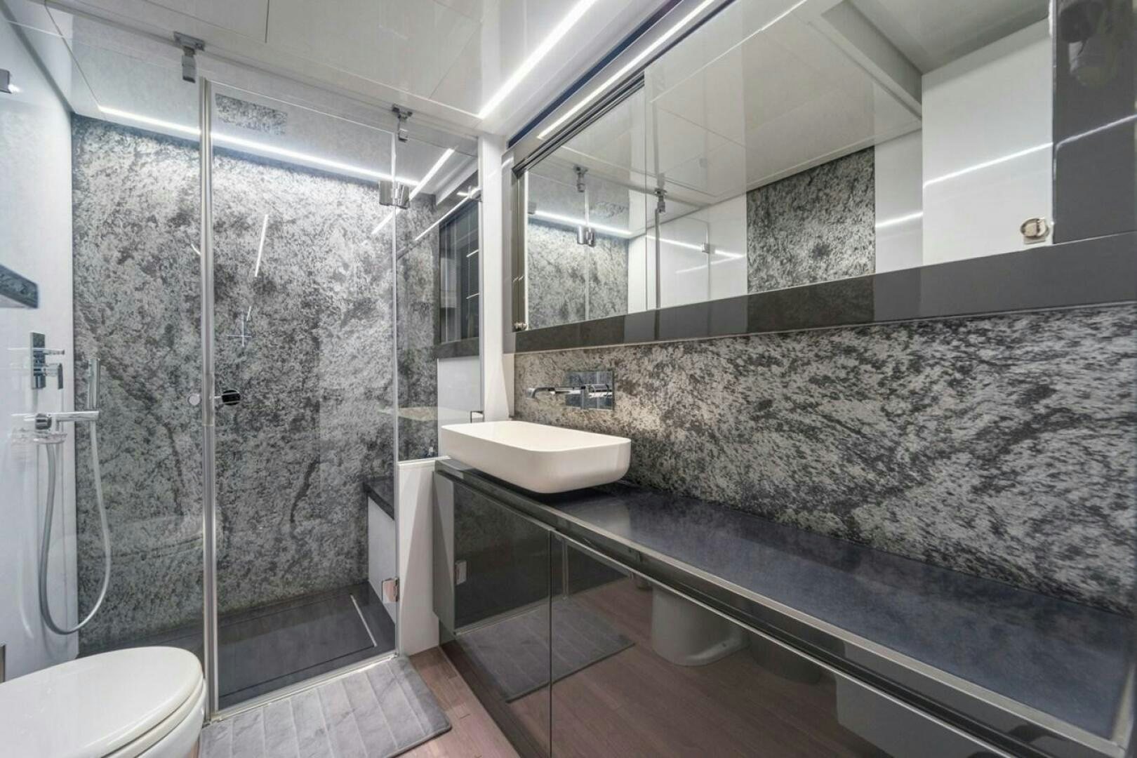 a bathroom with a marble counter top aboard STAR Yacht for Sale