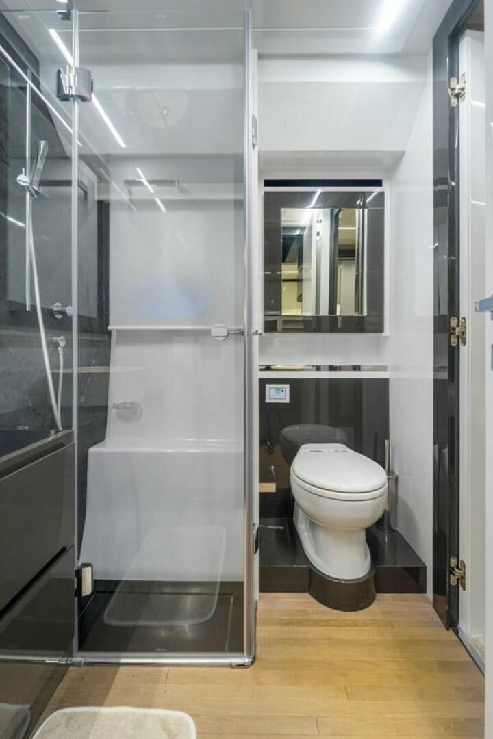 a bathroom with a glass shower aboard STAR Yacht for Sale