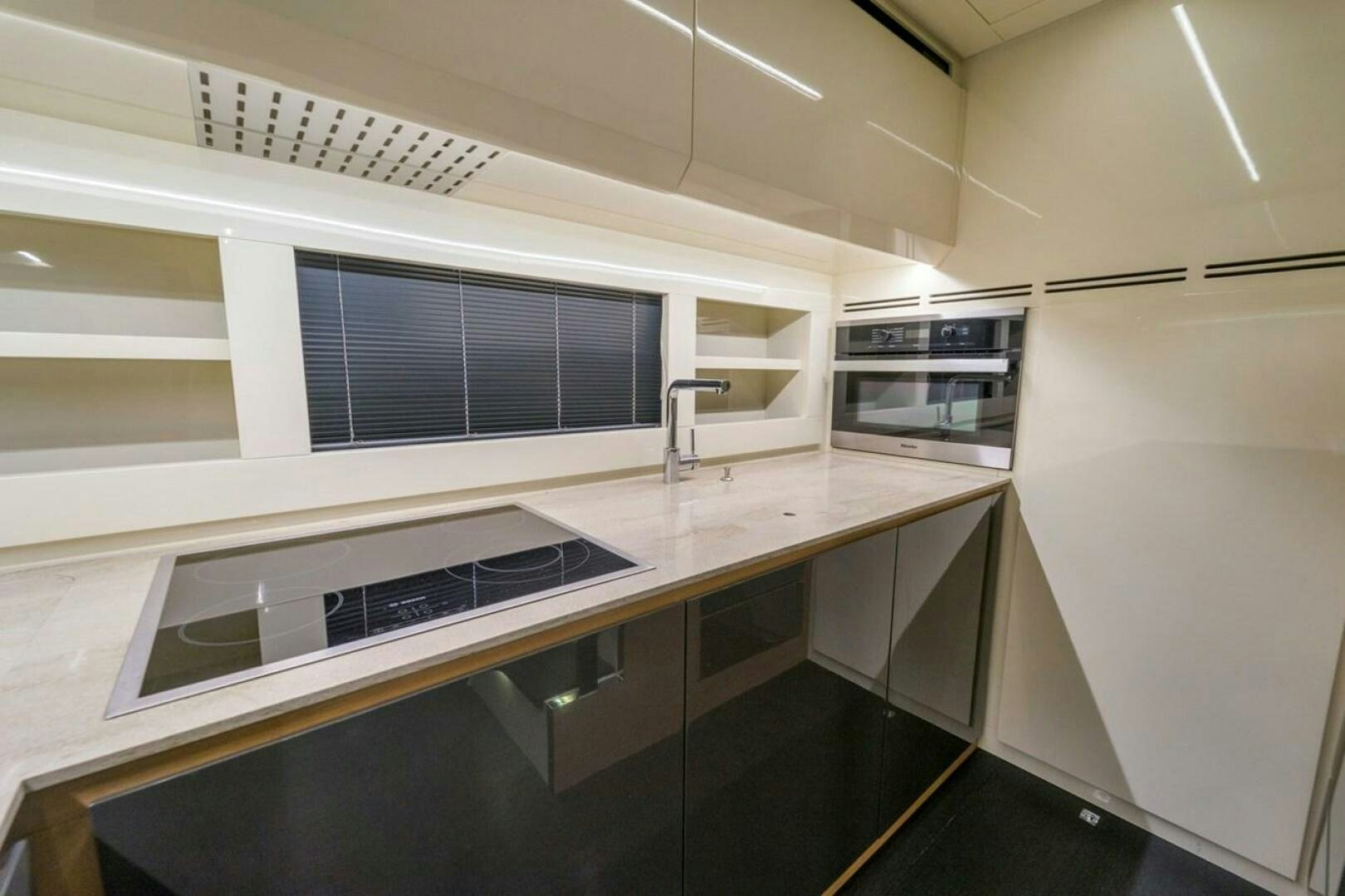 a kitchen with a large island aboard STAR Yacht for Sale