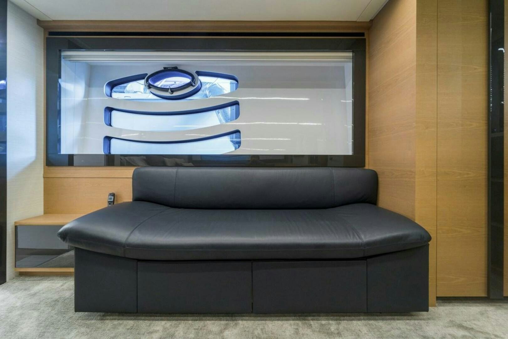a couch in front of a tv aboard STAR Yacht for Sale