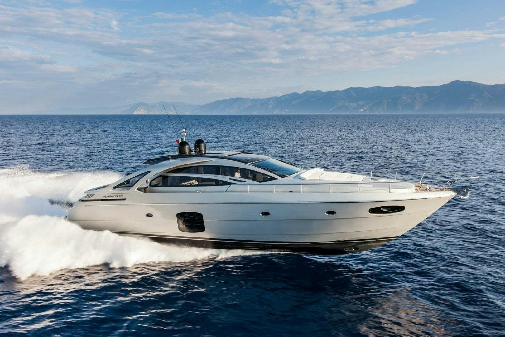 a white yacht on the water aboard STAR Yacht for Sale