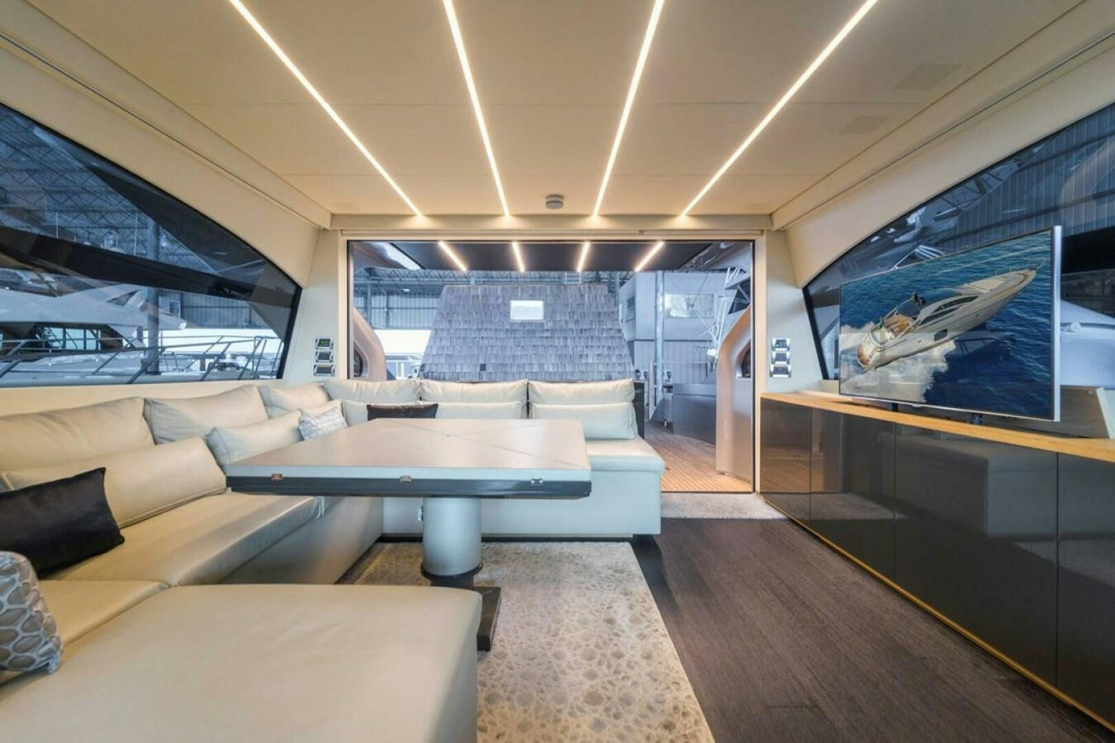 inside of a building with a large window and a couch aboard STAR Yacht for Sale