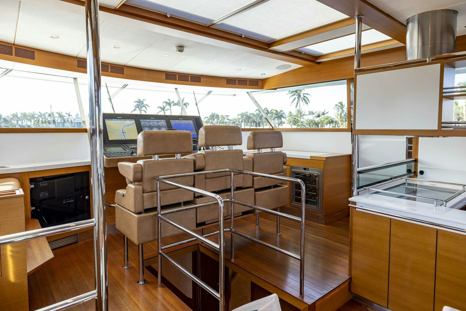 a room with chairs and a television aboard SEABISCUIT Yacht for Sale