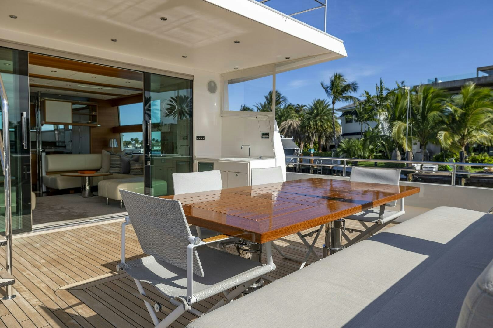 a modern looking room with a pool table and chairs aboard SEABISCUIT Yacht for Sale