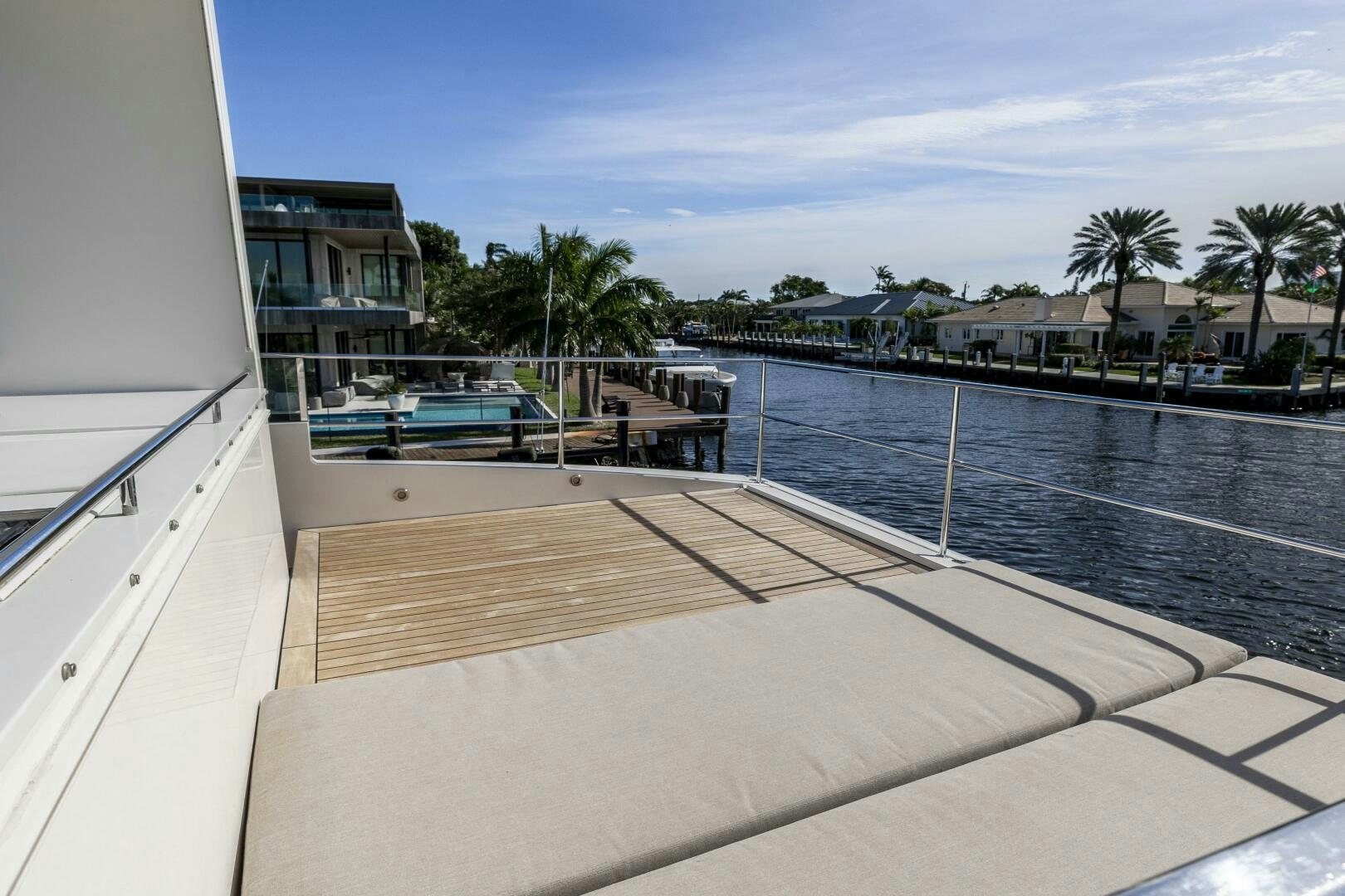 a deck with a pool and trees aboard SEABISCUIT Yacht for Sale