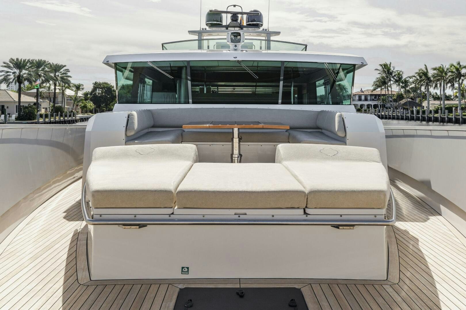a white couch in front of a white car on a deck aboard SEABISCUIT Yacht for Sale