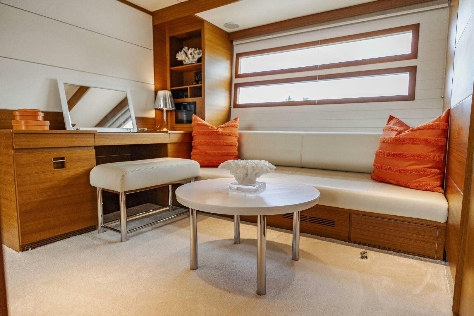 a room with a couch and a coffee table aboard SEABISCUIT Yacht for Sale