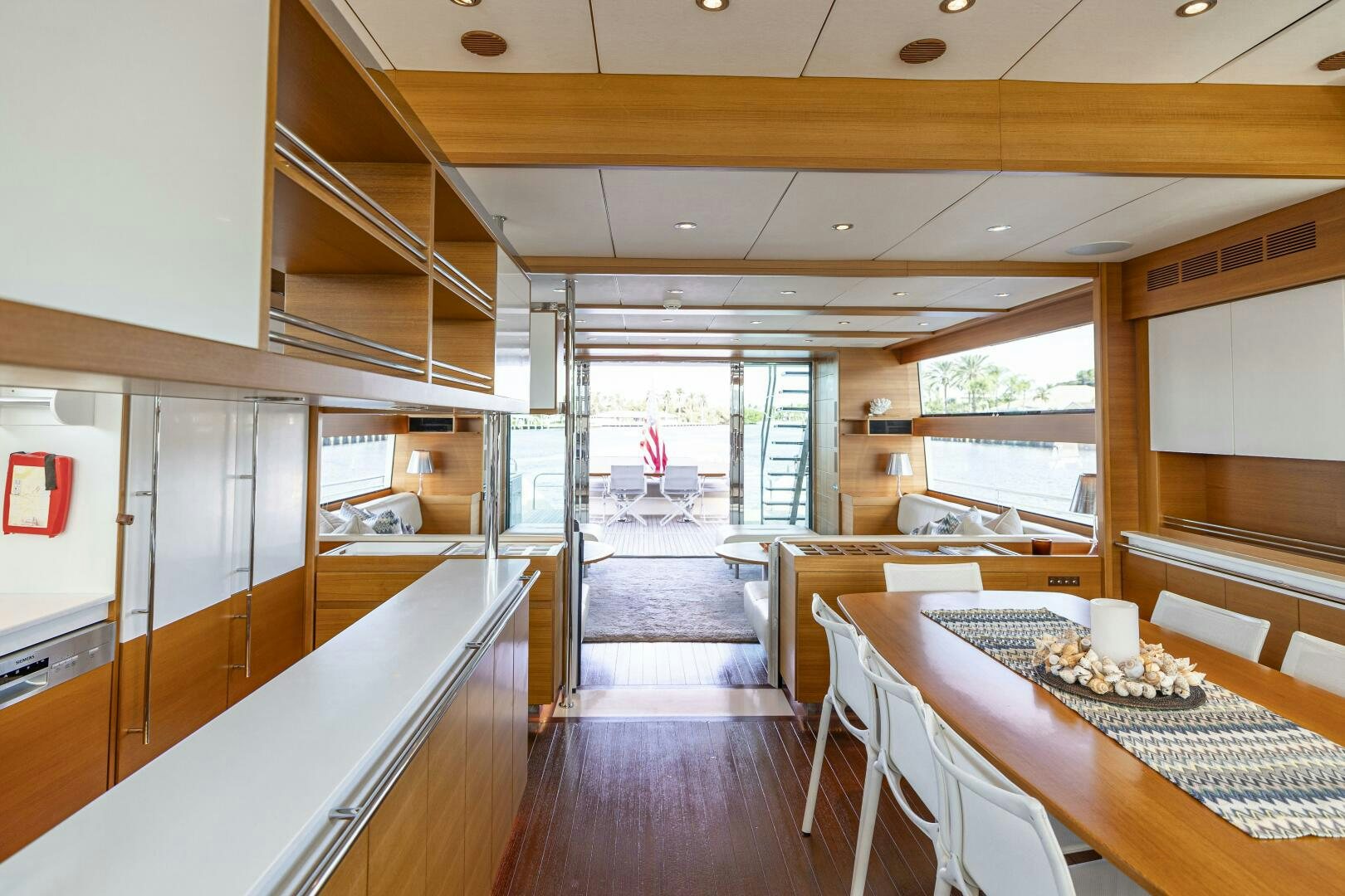 a room with a table and chairs aboard SEABISCUIT Yacht for Sale