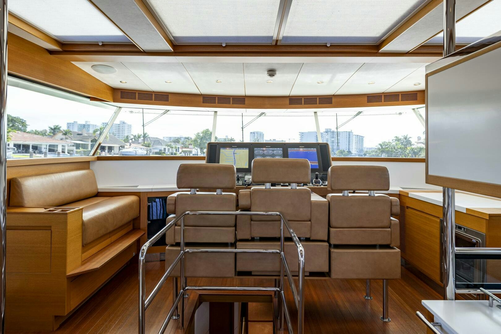 a room with chairs and a tv aboard SEABISCUIT Yacht for Sale