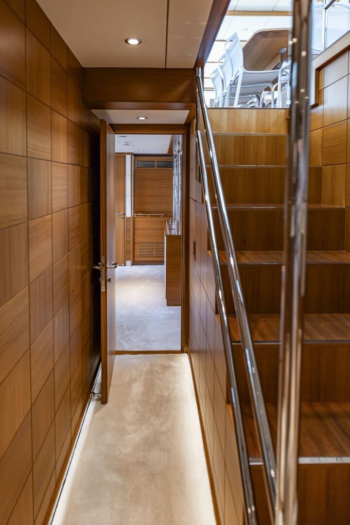 a hallway with glass doors aboard SEABISCUIT Yacht for Sale