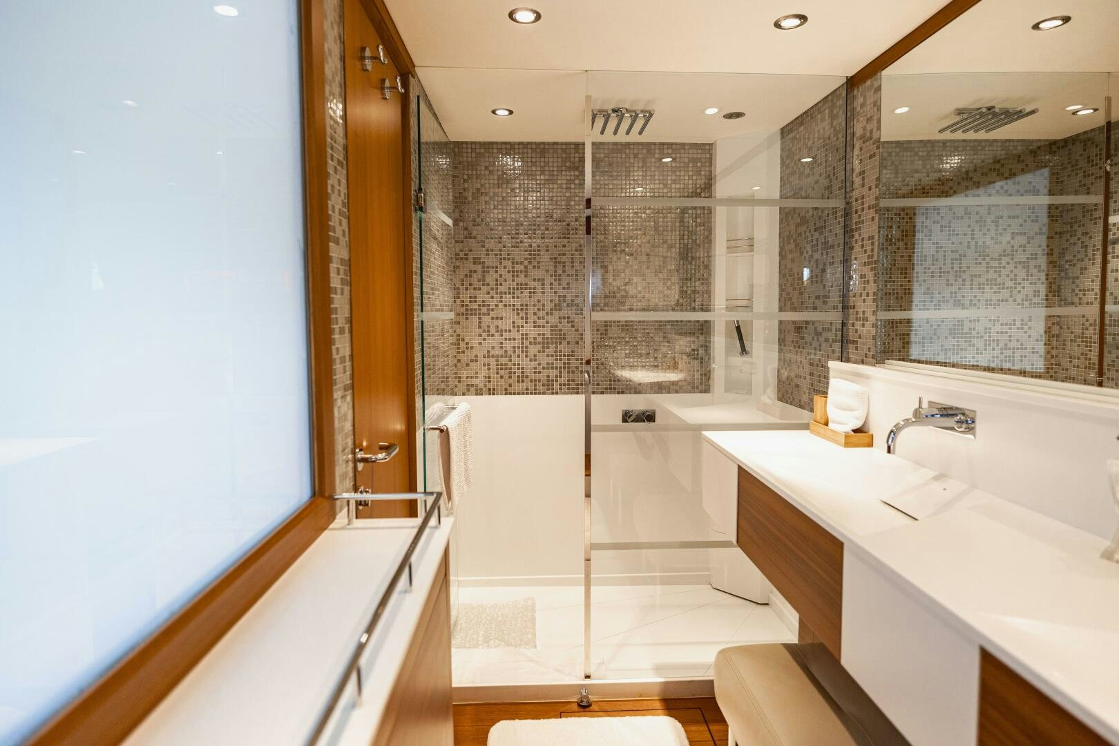 a bathroom with a large mirror aboard SEABISCUIT Yacht for Sale