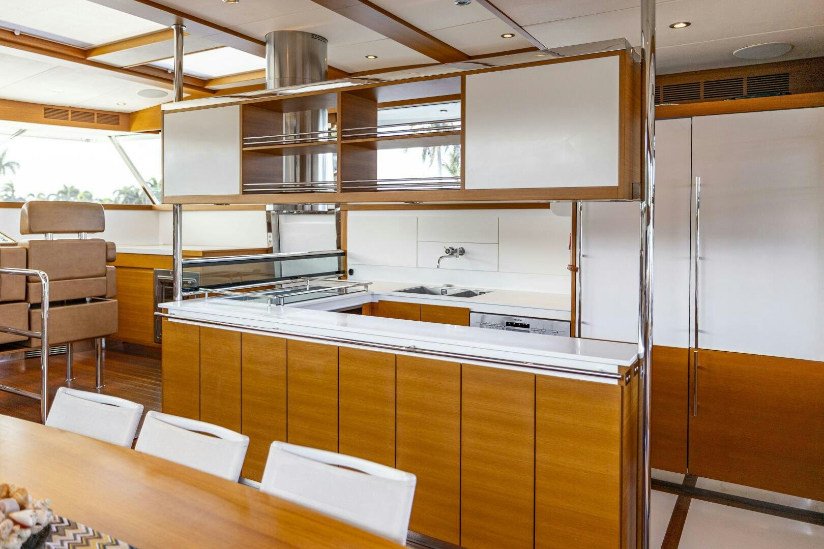 a room with a table and chairs aboard SEABISCUIT Yacht for Sale