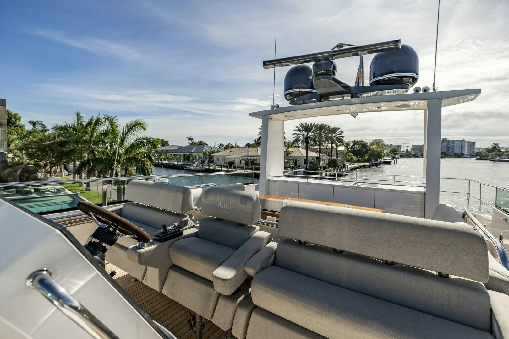 a large white building with a pool and a slide on the roof aboard SEABISCUIT Yacht for Sale