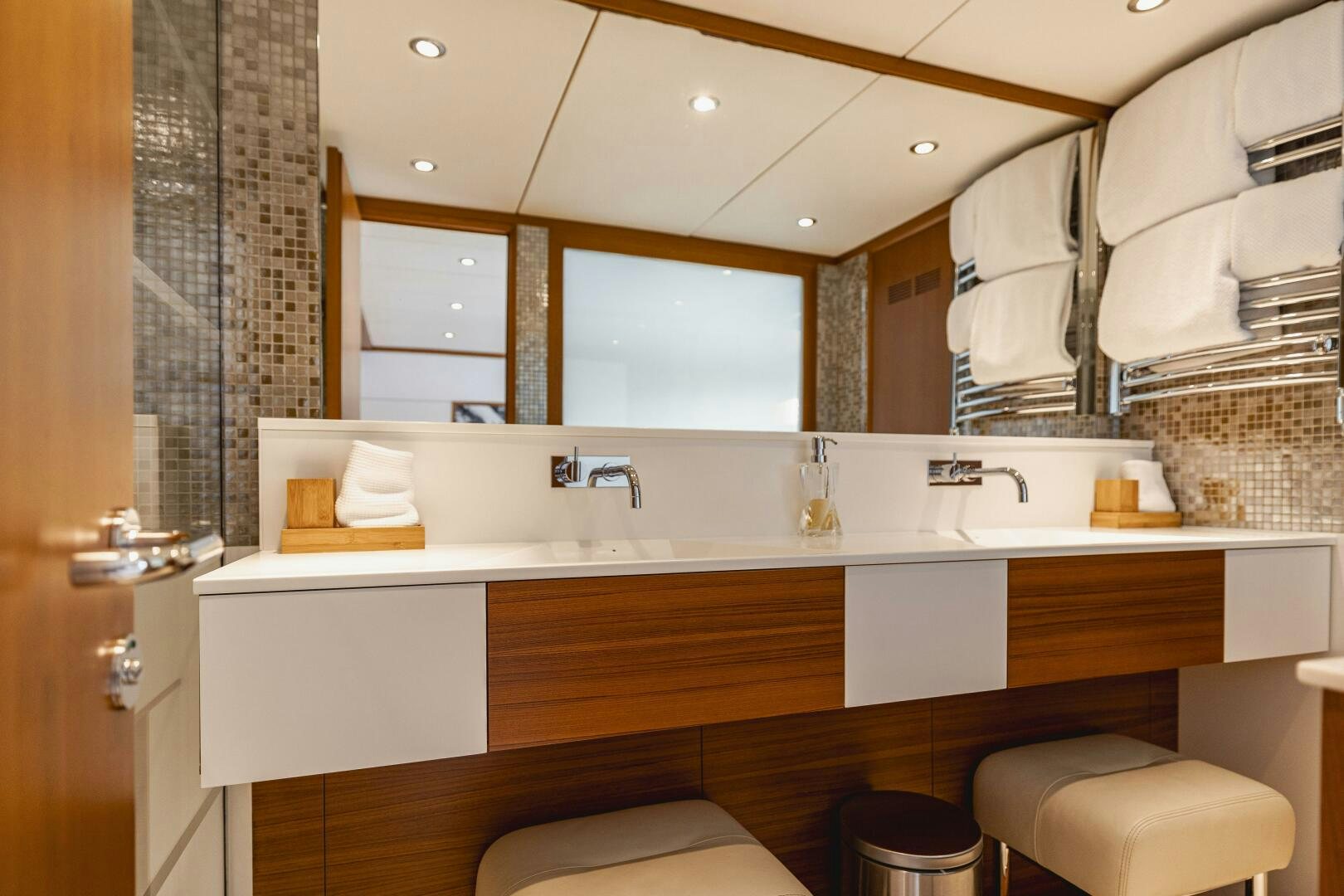 a bathroom with a countertop sink and mirror aboard SEABISCUIT Yacht for Sale