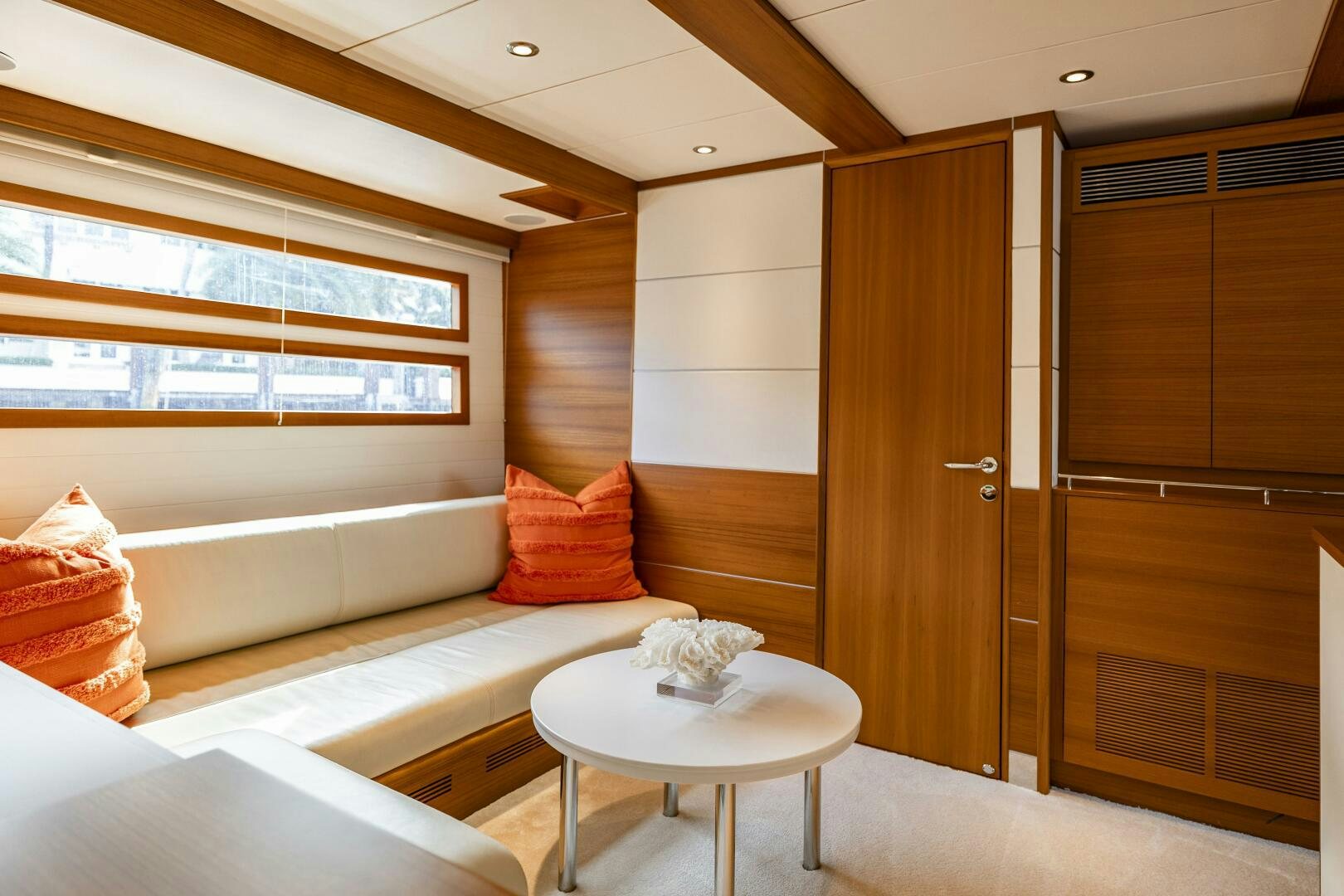 a room with a couch and a table aboard SEABISCUIT Yacht for Sale