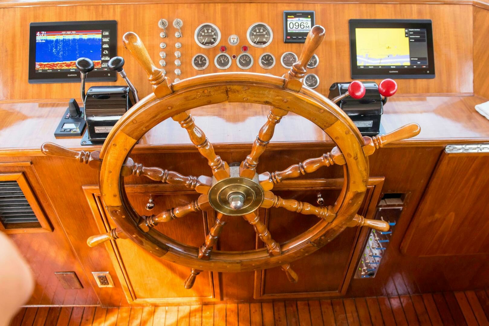 a wooden steering wheel aboard TIMELESS Yacht for Sale