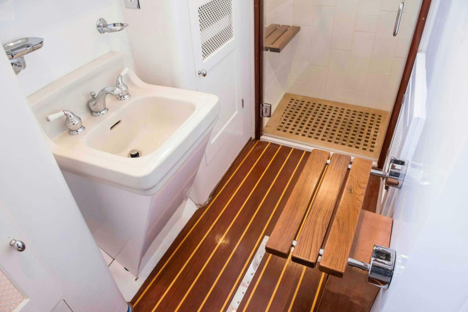 a sink and a mirror in a bathroom aboard TIMELESS Yacht for Sale