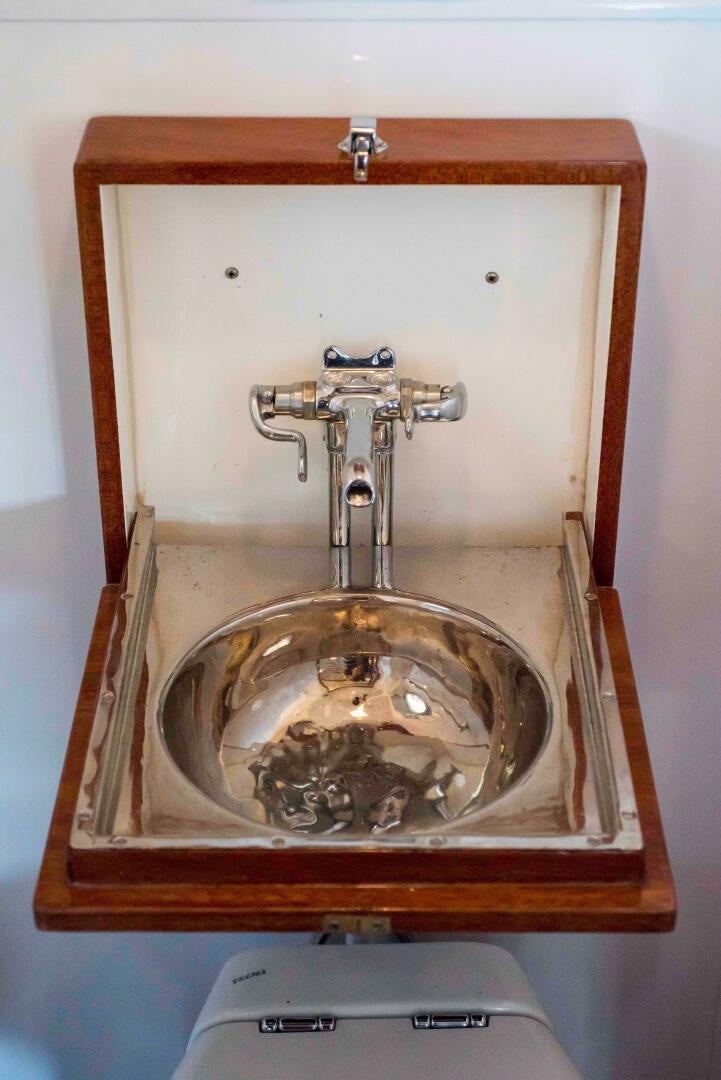 a sink with a mirror aboard TIMELESS Yacht for Sale