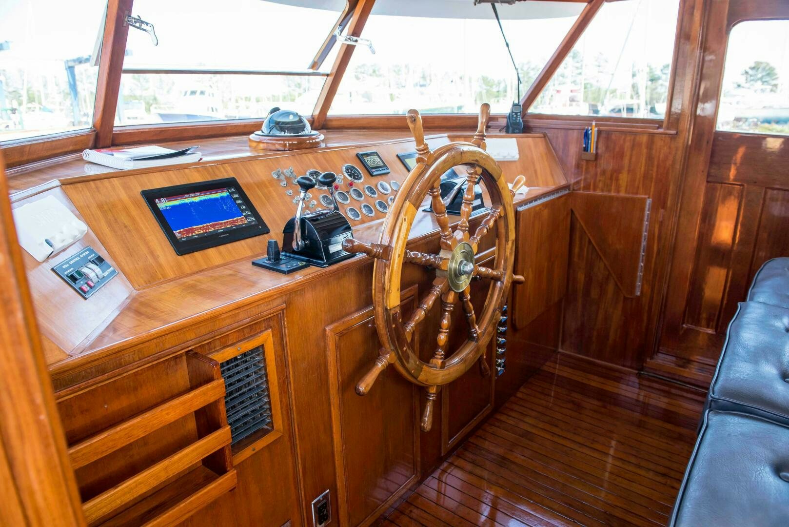 a wooden boat with a steering wheel aboard TIMELESS Yacht for Sale