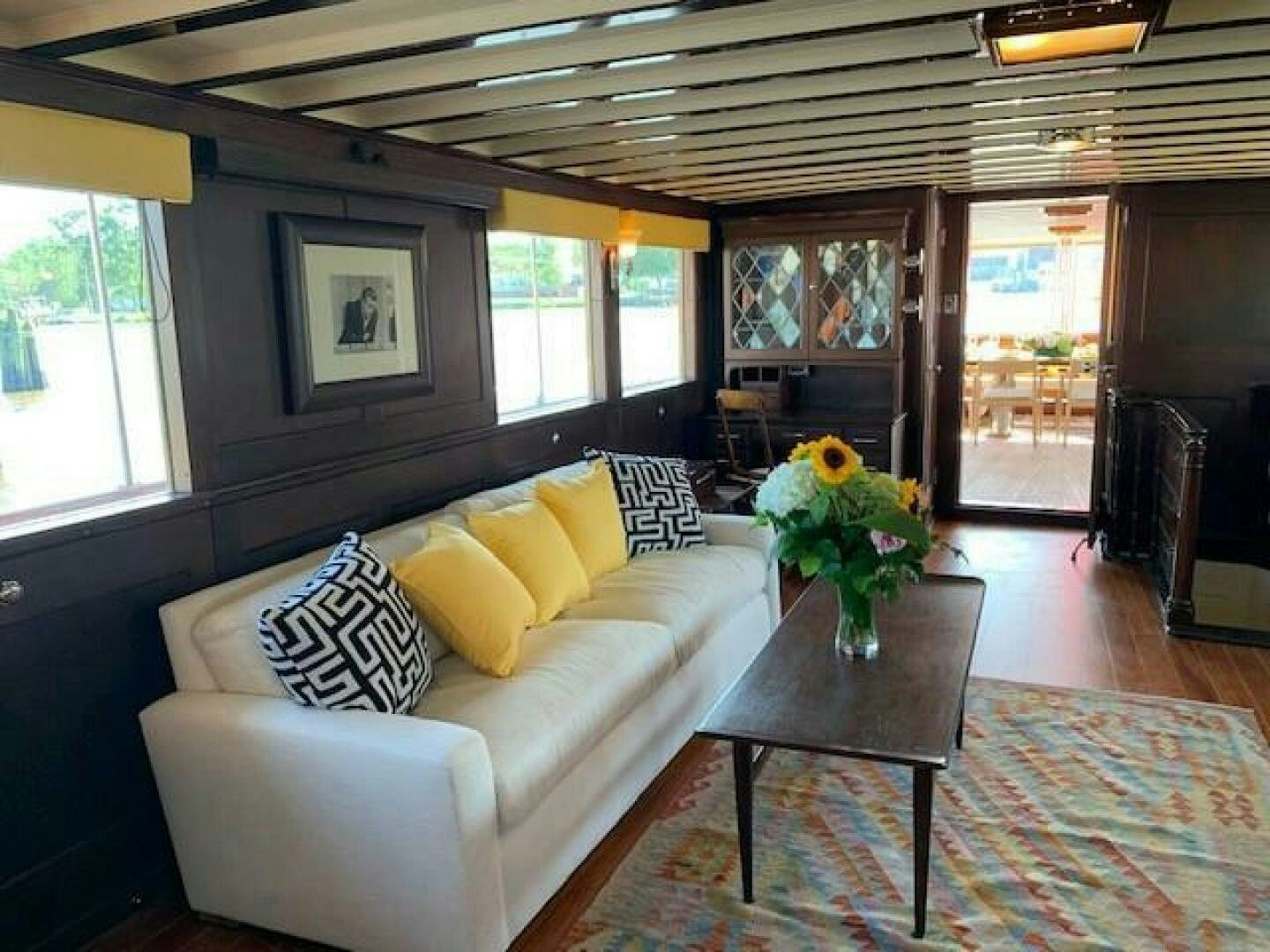 a living room with a couch and a coffee table aboard TIMELESS Yacht for Sale