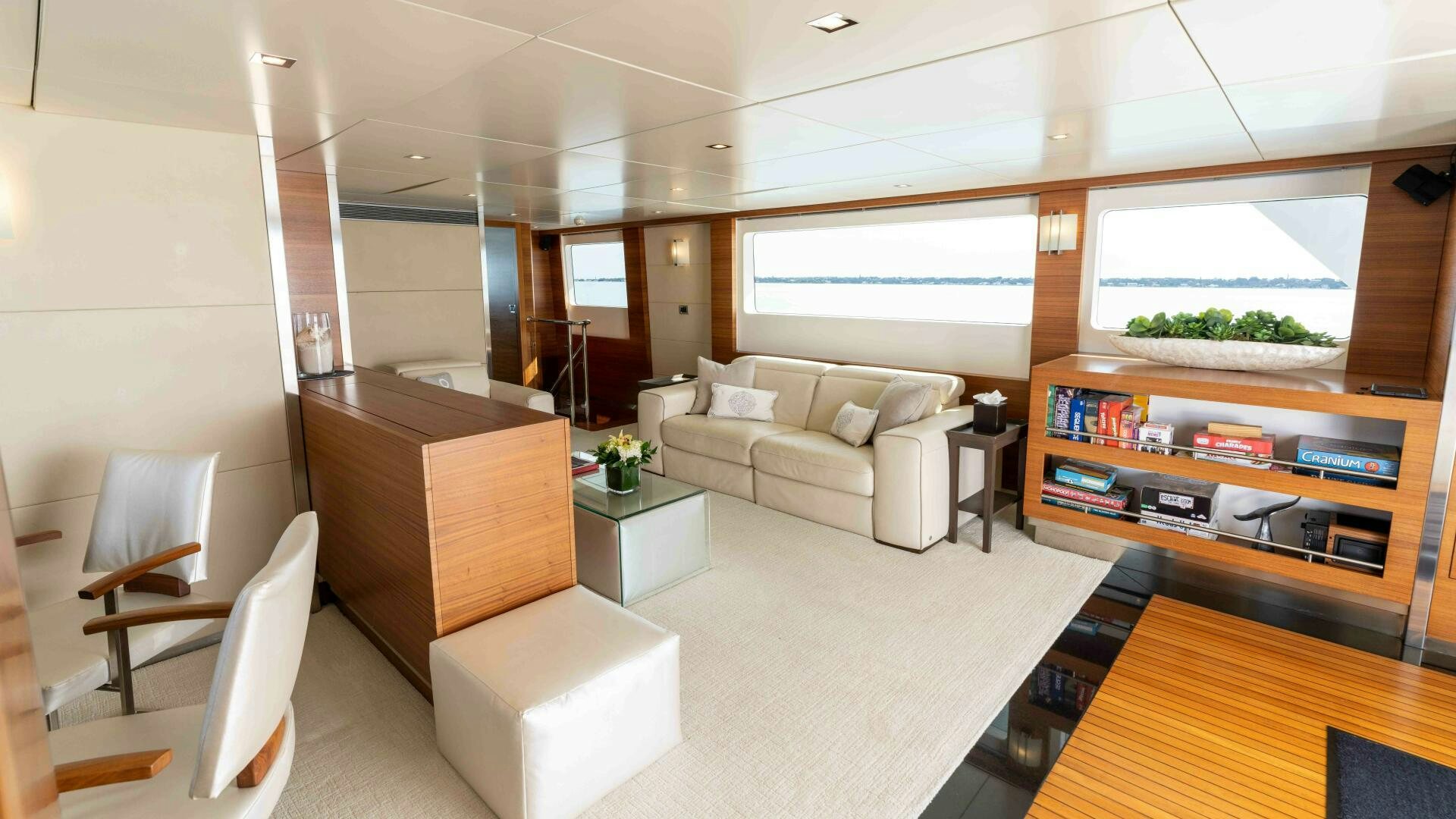 a living room with a couch and a coffee table aboard SEA AXIS Yacht for Sale