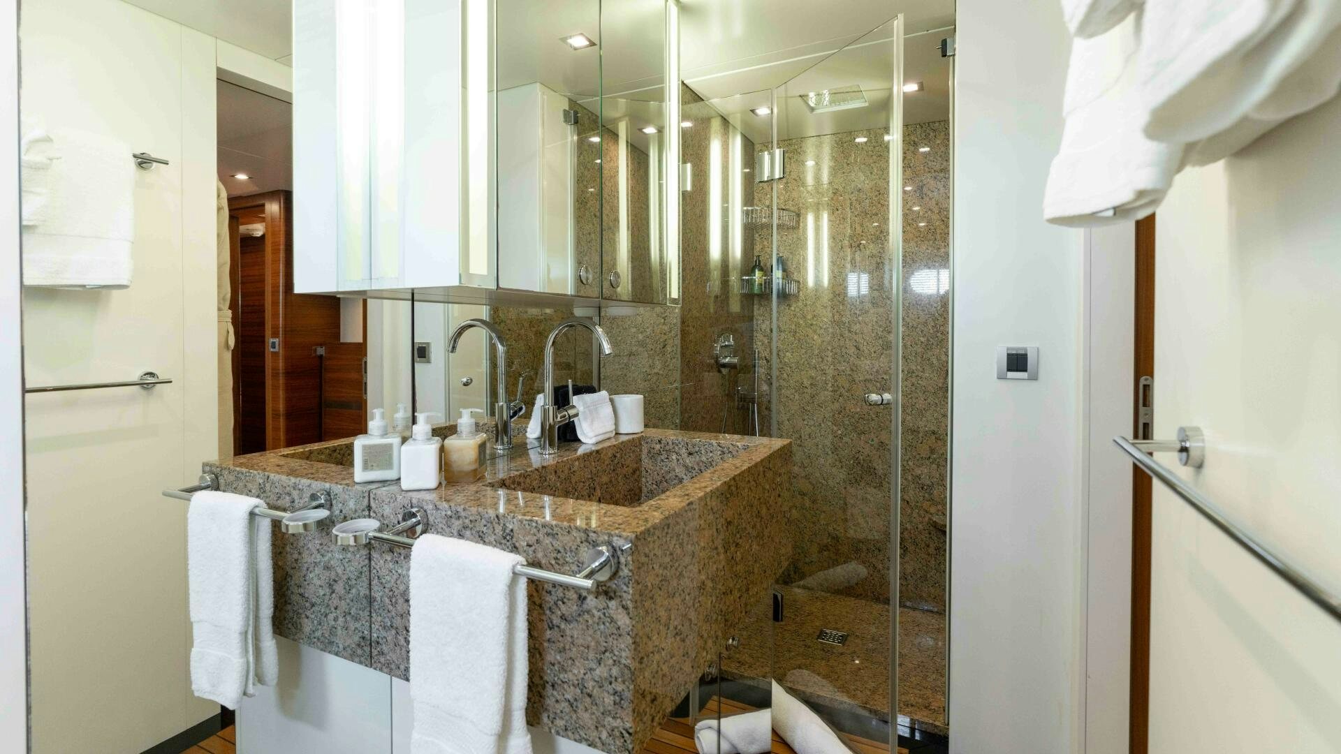 a bathroom with a sink and a shower aboard SEA AXIS Yacht for Sale