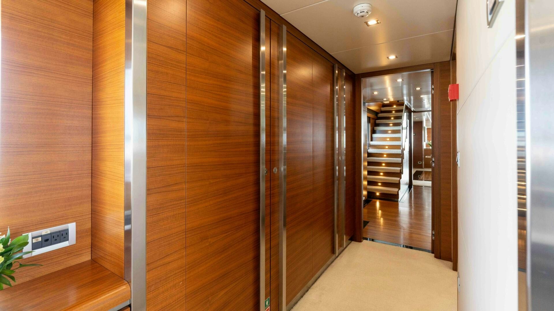 a room with wooden doors aboard SEA AXIS Yacht for Sale