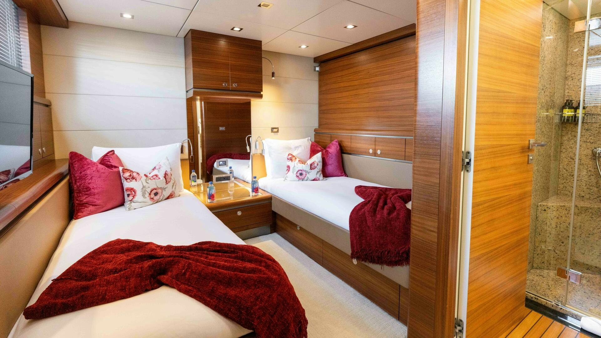 a room with a bed and a mirror aboard SEA AXIS Yacht for Sale