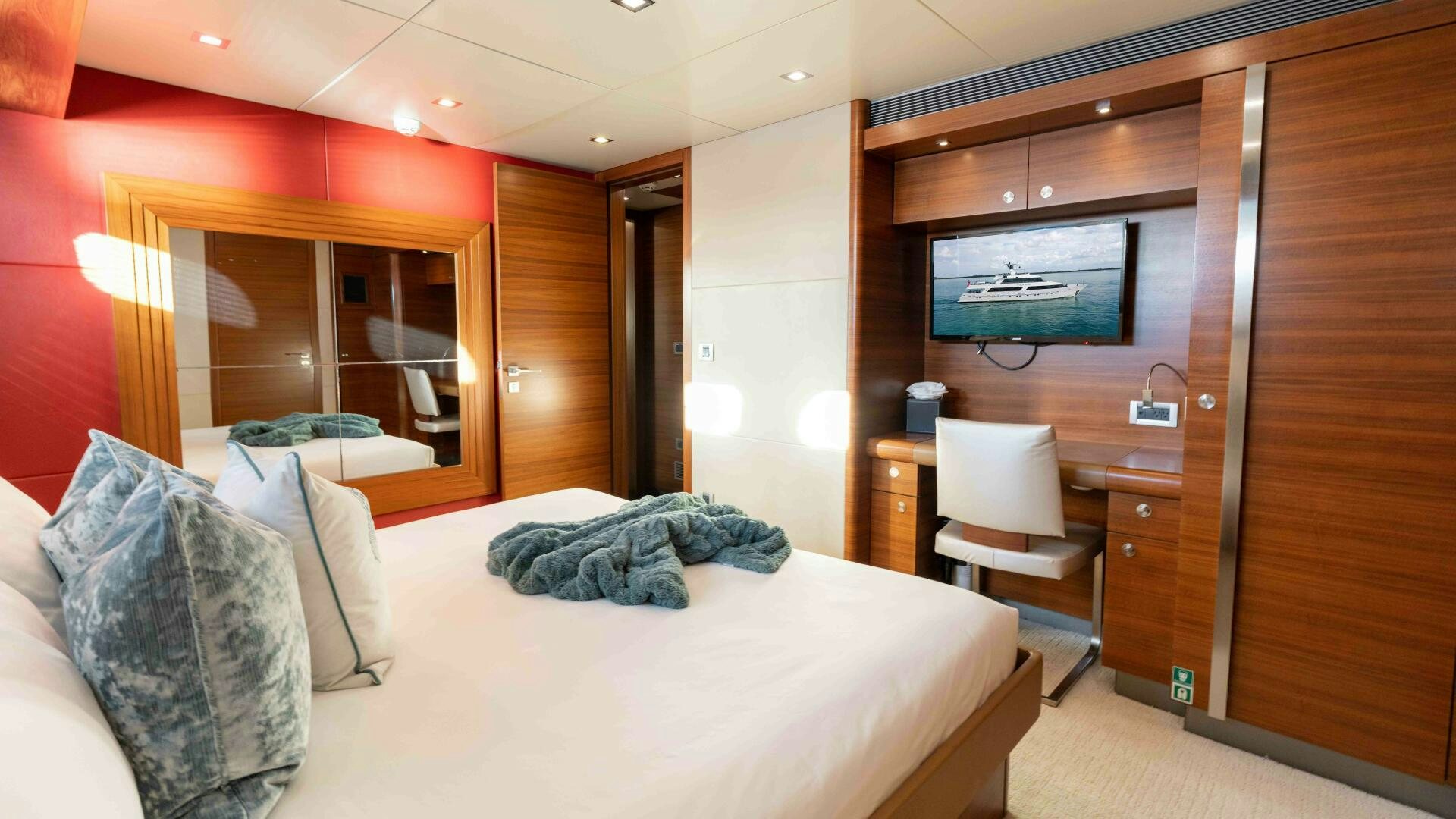 a hotel room with a bed and a tv aboard SEA AXIS Yacht for Sale