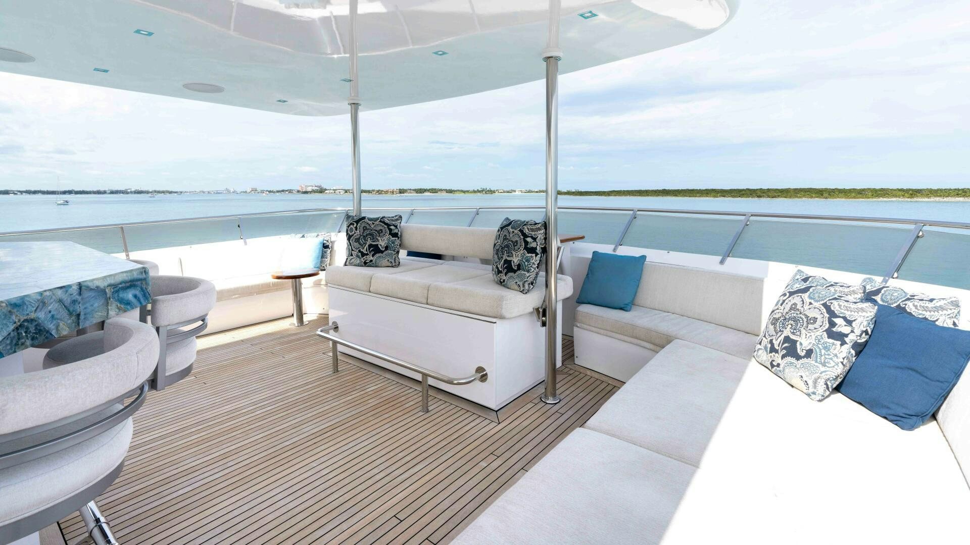 a room with a bed and a couch aboard SEA AXIS Yacht for Sale
